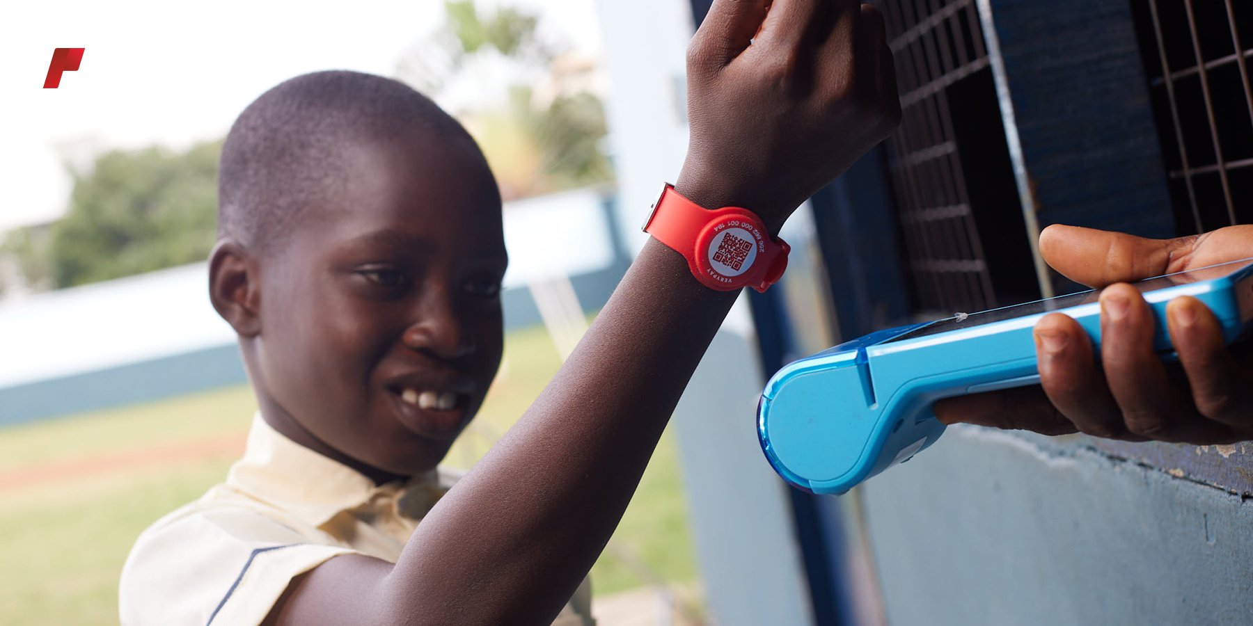 Boy paying with VeryPay Bracelet